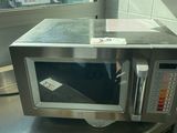 a microwave sitting on top of a counter in a kitchen