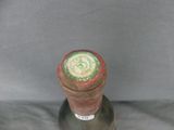 a bottle of wine that is sitting on a table
