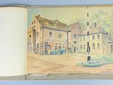 a book with a picture of a town on it
