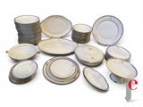 a lot of plates that are sitting on a table