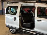 a white van with its doors open in a garage