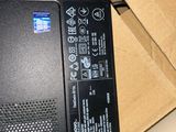 a laptop computer sitting on top of a cardboard box