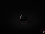 a black box in the middle of a dark room