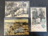 three old postcards of people on a street with a train in the background