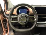 the interior of a car with a steering wheel and dashboard controls