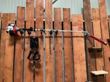 a man that is standing in front of a wall with tools
