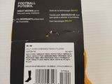 the back of a person ' s hand holding a box of football socks