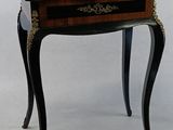 a small table with a drawer on top of it