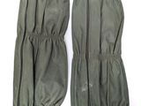 two pairs of military gaiters with zippers on them on a white surface