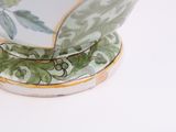 a close up of a bowl on a white surface