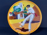 une assiette sur laquelle est représenté un homme jouant au baseball