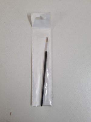 a pencil in a plastic bag with a black handle