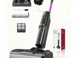 a close up of a vacuum cleaner with a purple handle