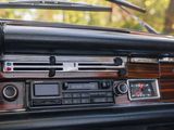 a dashboard of a car with a clock and radio in it