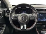 the interior of a car with a steering wheel and dashboard controls