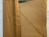 a piece of brown paper that has been folded over