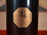 a wine bottle with a label on it on a table