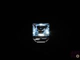 a square blue topazte gems in a black background