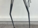 a sculpture of a bird made out of metal