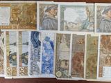 a lot of different bank notes on the table