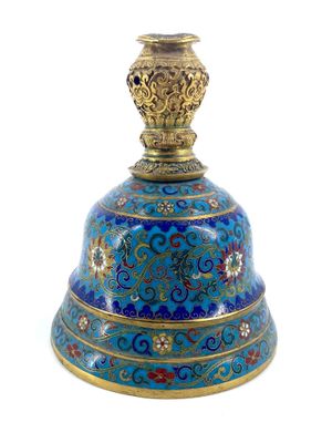 une image représentant une clochette bleue ornée de motifs dorés