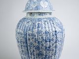blue and white porcelain jar with lid with a bird on top