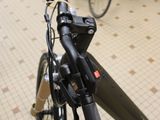 a bicycle that is parked in a room with many bikes