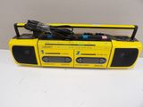 an image of a yellow cassette player sitting on top of a white table
