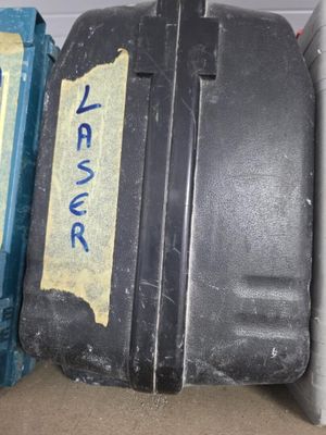 two pieces of luggage sitting next to each other on the floor
