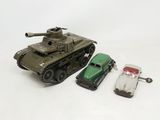 a toy tank and a toy car next to each other