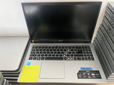 a laptop computer sitting on top of a stack of folders