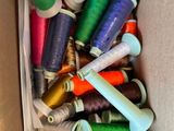many spools of thread in a box