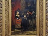 une image représentant un tableau où l'on voit un homme et une femme assis sur une chaise