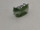 a small piece of glass that is sitting on the floor