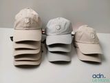 several hats are lined up on a table in a row