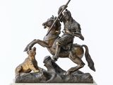 statue of a man on a horse with a dog on a white background
