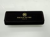 a black leather case with a gold logo on it