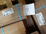 a lot of wooden pallets stacked on top of each other