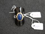 a ring with a blue stone on it and a price tag