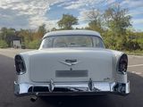 a white car that is parked on the side of the road
