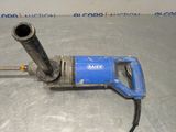 a blue and black electric drill on a table