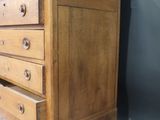 a wooden dresser with a mirror on top of it
