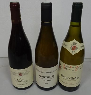 three bottles of wine sitting on a table next to each other