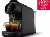 a close up of a coffee machine with two cups of coffee