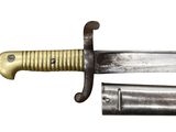 a close up of a knife with a metal handle on a white background