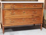 a picture of a dresser with a mirror on top of it