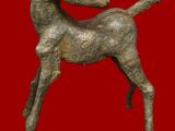 statue of a horse on a red background with a red background
