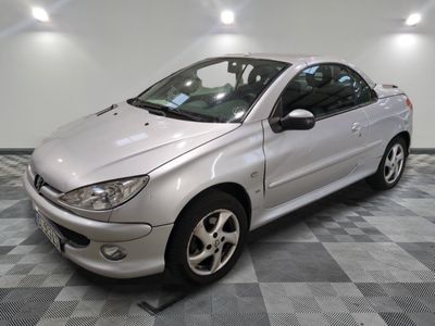 a picture of a silver car parked in a garage