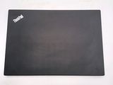 a black mouse pad with a white sticker on it