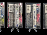 three packages of toothbrushes are lined up in a row